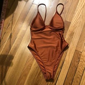 Brand new without tags, never worn forever 21 one piece bathing suit.